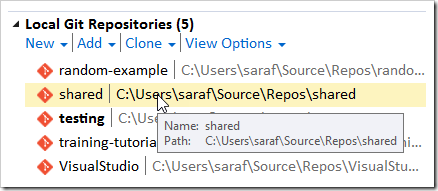Double click in Team Explorer to switch repositories